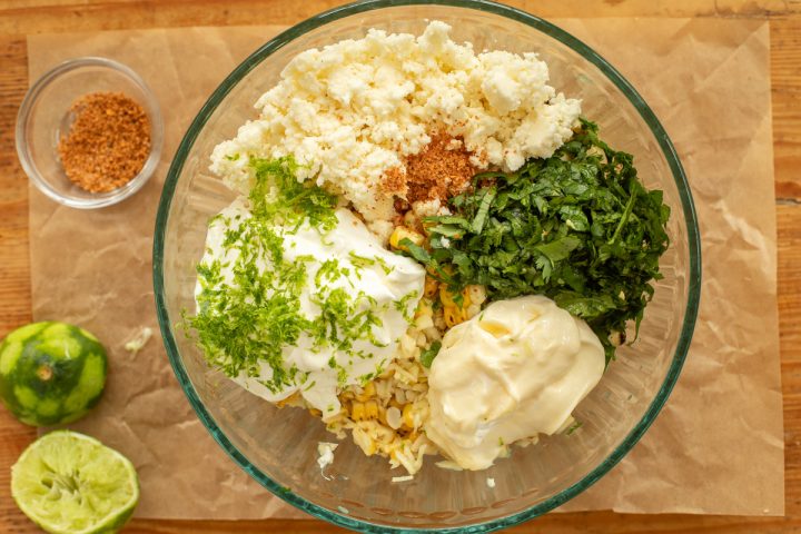 Mexican street corn ingredients in a glass bowl.